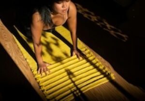 Woman doing yoga in shadows Photo by Alexandra Tran on Unsplash