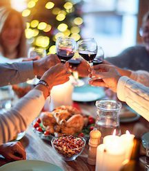 Family at dining table holidays photo by Photo by krakenimages on Unsplash