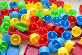 Game pieces of different colors Photo by Vardan Papikyan on Unsplash