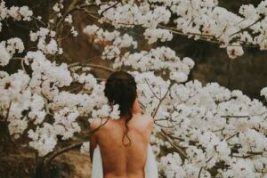 Woman with flowers Photo by Rodolfo Sanches Carvalho on Unsplash
